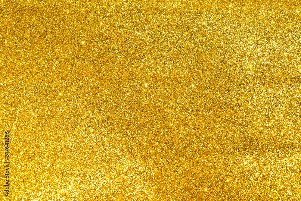 sparkles of golden glitter texture background