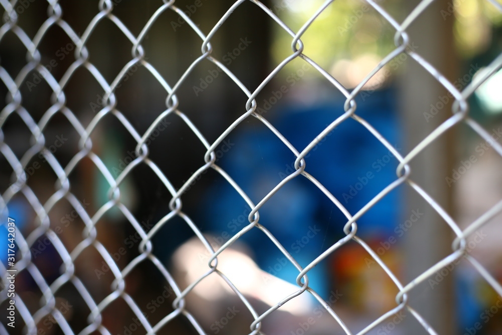Fototapeta premium chain link fence with barbed wire