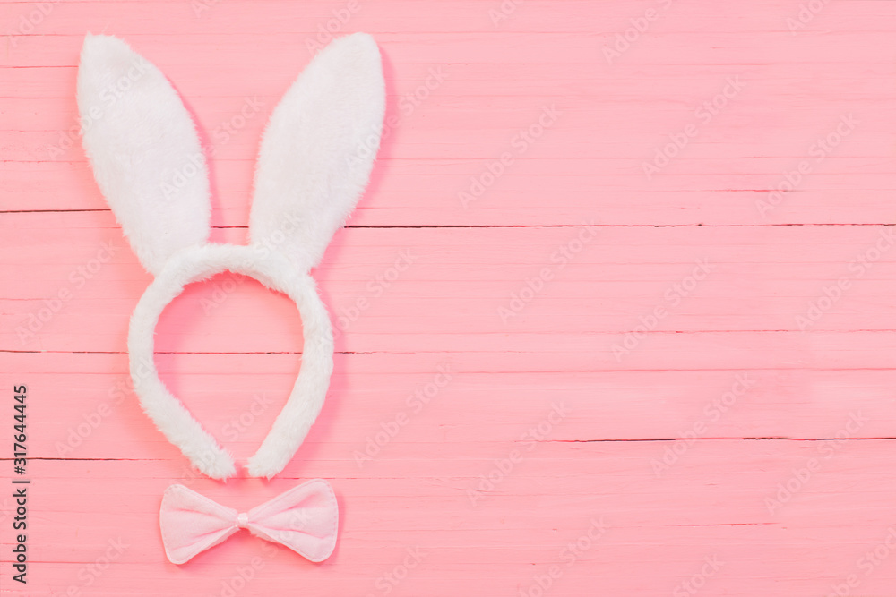 Easter decorations on pink wooden background