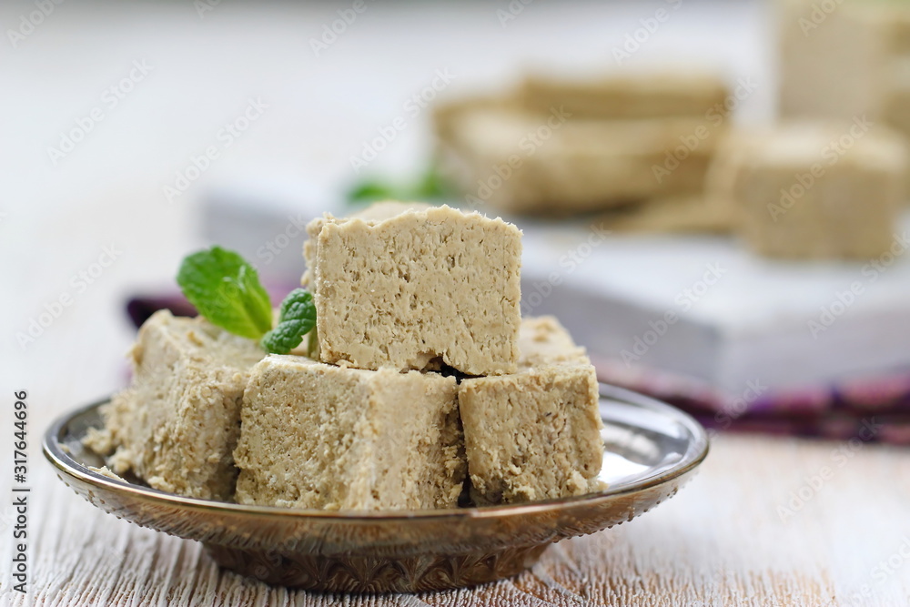 Sliced sunflower halva on the table. Delicious food.