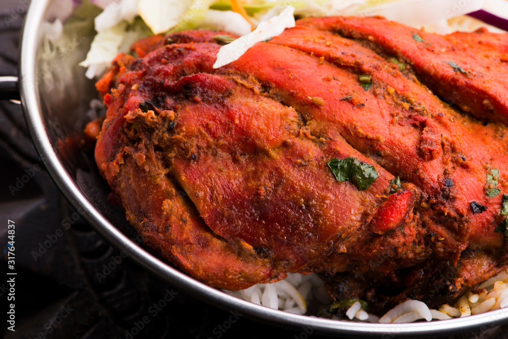 Close-up of a plate of chopped tandoori chicken Close-up of a plate of chopped tandoori chicken
