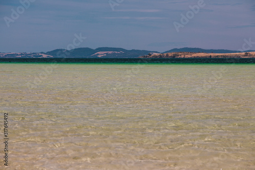 view of Dunalley Beach in Tasmania, Australia with sandbanks and shallow pristine water photo