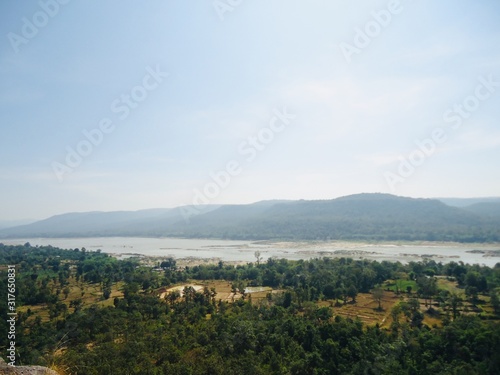 Landscape view point of low mountain, see forest, river and valley © GK_musaico