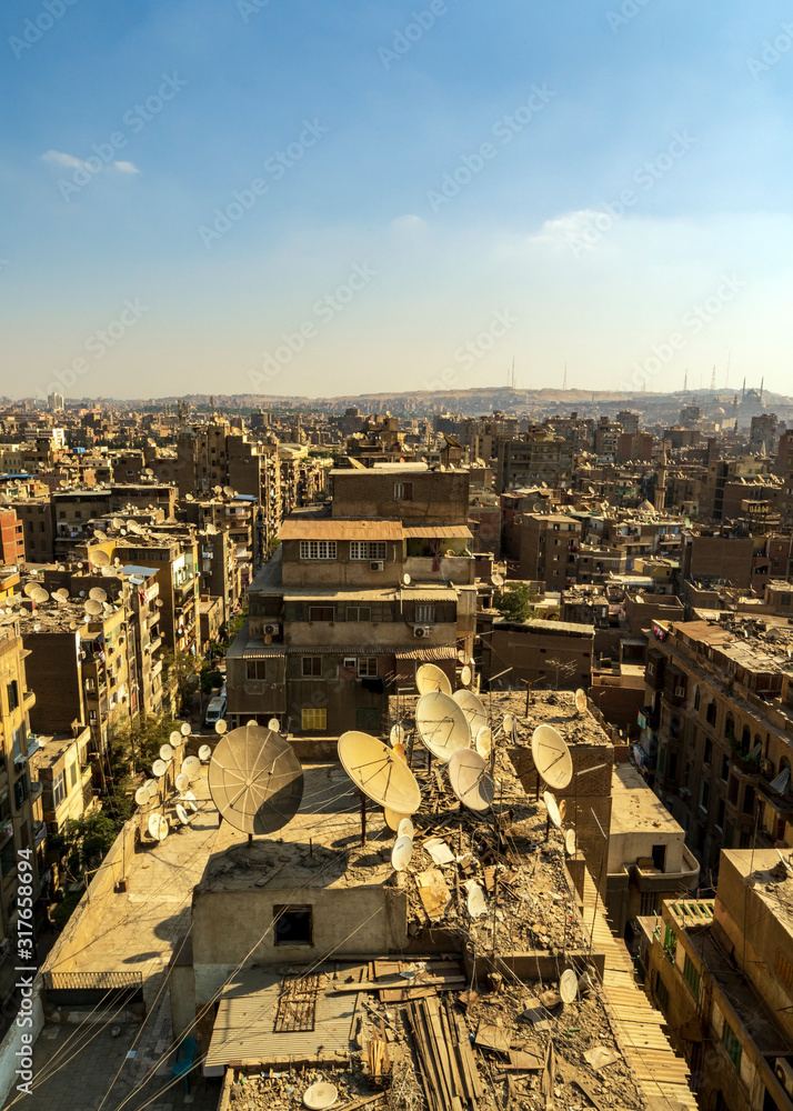 Cairo rooftops are filled by satellite dishes