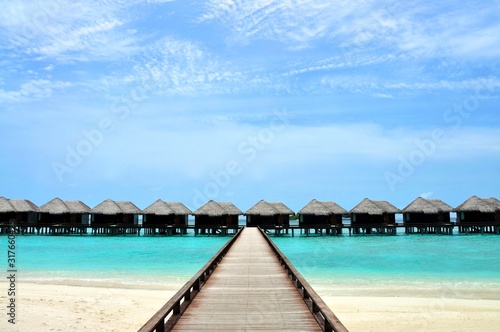 Tropical paradise resort over turquose waters photo