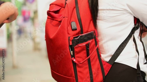 closeup The pickpocket is picking up money from tourists who are traveling