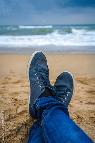 Lonely shoes in a lonely beach