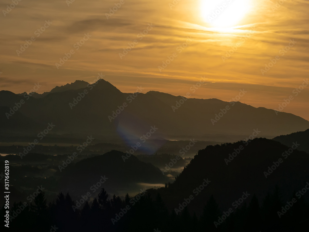 View on the beautiful sunrise over the majestic hills with the Lake Bled in Slovenia View on the beautiful sunrise over the majestic hills with the Lake Bled in Slovenia