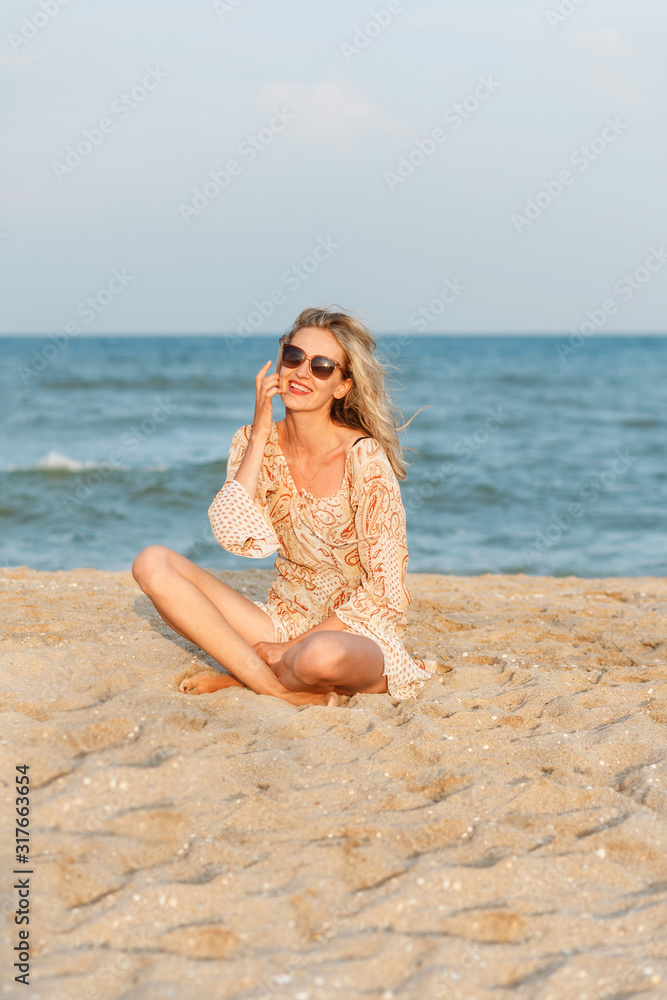Portrait of young woman by the sea. Portrait of young woman by the sea.