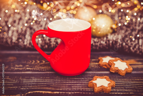 Mug in the shape of a heart on a festive background
