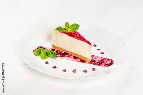 Slice of cheesecake garnished with mint garnished