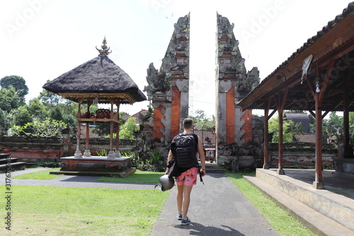 man walking on temple in ubud