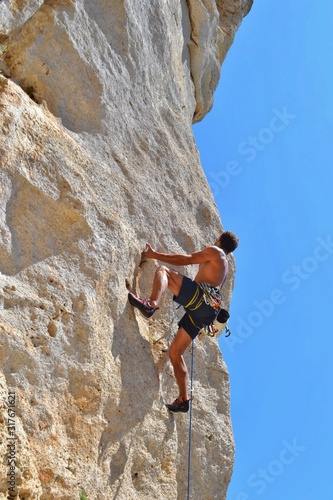 Young man, rock climbing, Finale Ligure Italy.