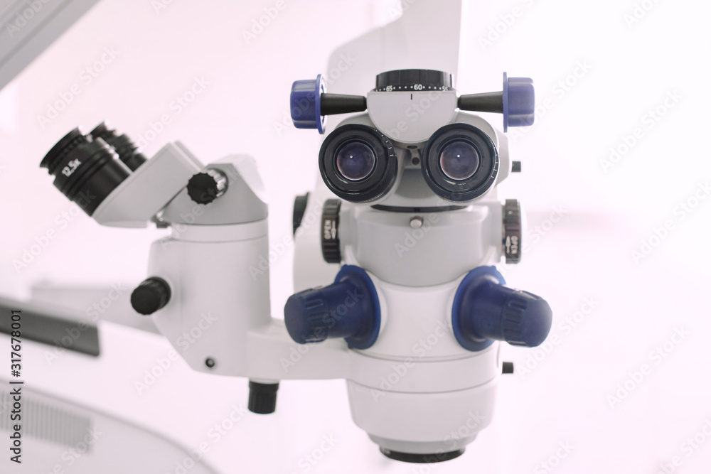 Medical ophthalmology professional equipment. Microsurgical microscope in a operating room. Ophthalmologist clinic concept Medical ophthalmology professional equipment. Microsurgical microscope in a operating room. Ophthalmologist clinic concept