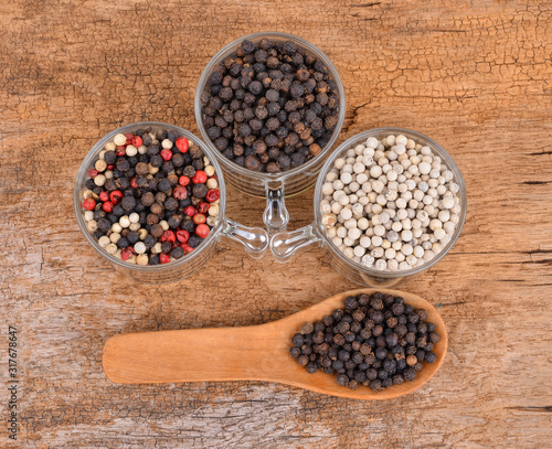 Pepper mix  on wooden background.