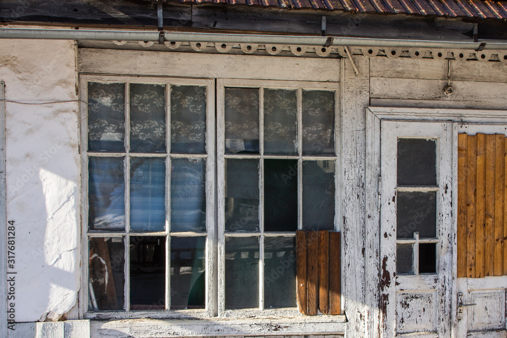 Ancient window frame in a wooden house in the Carpathian village of Yaremche. Ukraine Ancient window frame in a wooden house in the Carpathian village of Yaremche. Ukraine