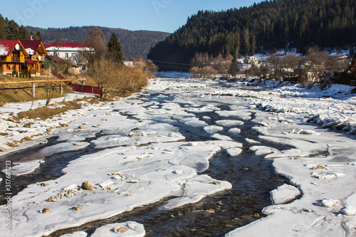 The frozen river Prut in the Carpathian village of Yaremche. Ukraine