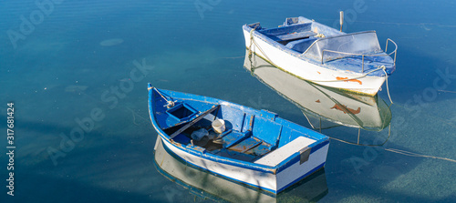 Two row boats in the water © Angela Rohde
