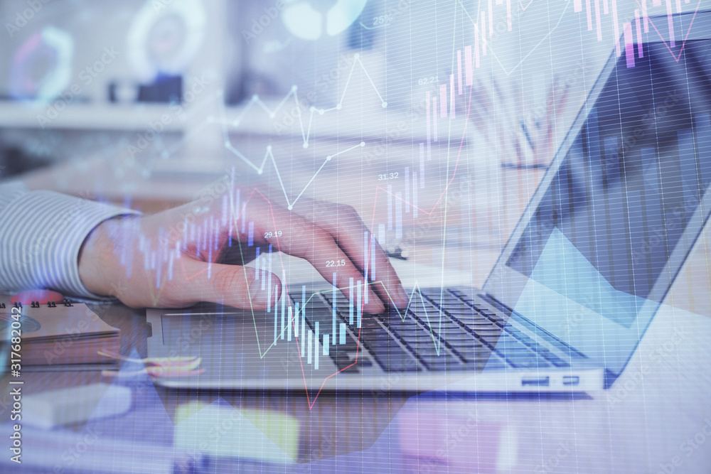 Double exposure of stock market graph with man working on laptop on background. Concept of financial analysis. Double exposure of stock market graph with man working on laptop on background. Concept of financial analysis.