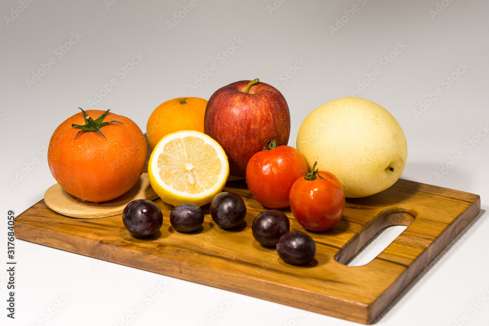 Various fruits on cutting board