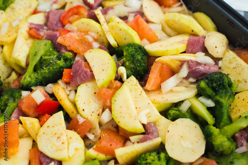 healthy food cooking - turkey meat and vegetables in the pan