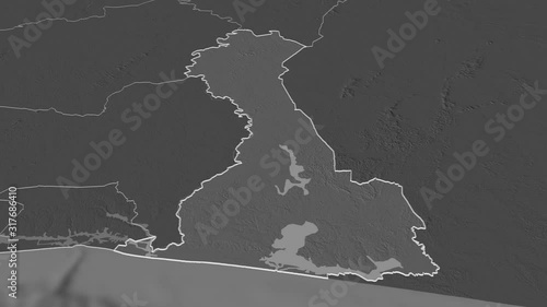 Comoé, district with its capital, zoomed and extruded on the bilevel map of Côte d'Ivoire in the conformal Stereographic projection. Animation 3D photo