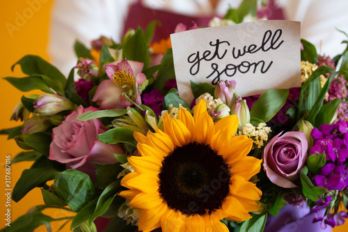 "get well soon" note on a nice flower bouquet