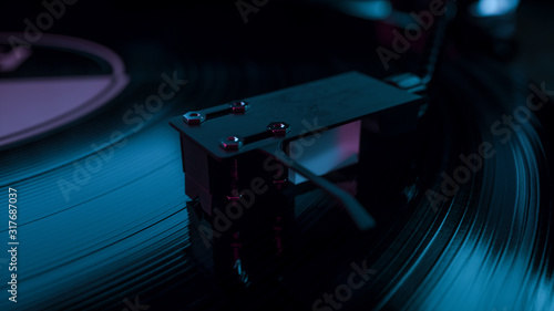 Vintage turn table player in close up.Retro style turntables needle playing old analog vinyl disc with music.Hipster audio equipment