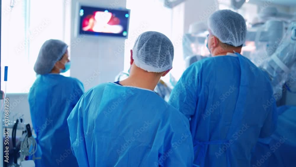 Medical team helping patient. Group of surgeon is working in operating theatre. Medical team helping patient. Group of surgeon is working in operating theatre.