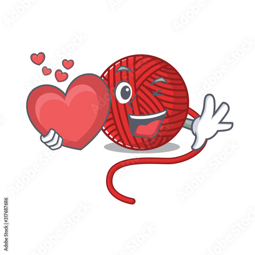 Funny Face red wool yarn cartoon character holding a heart