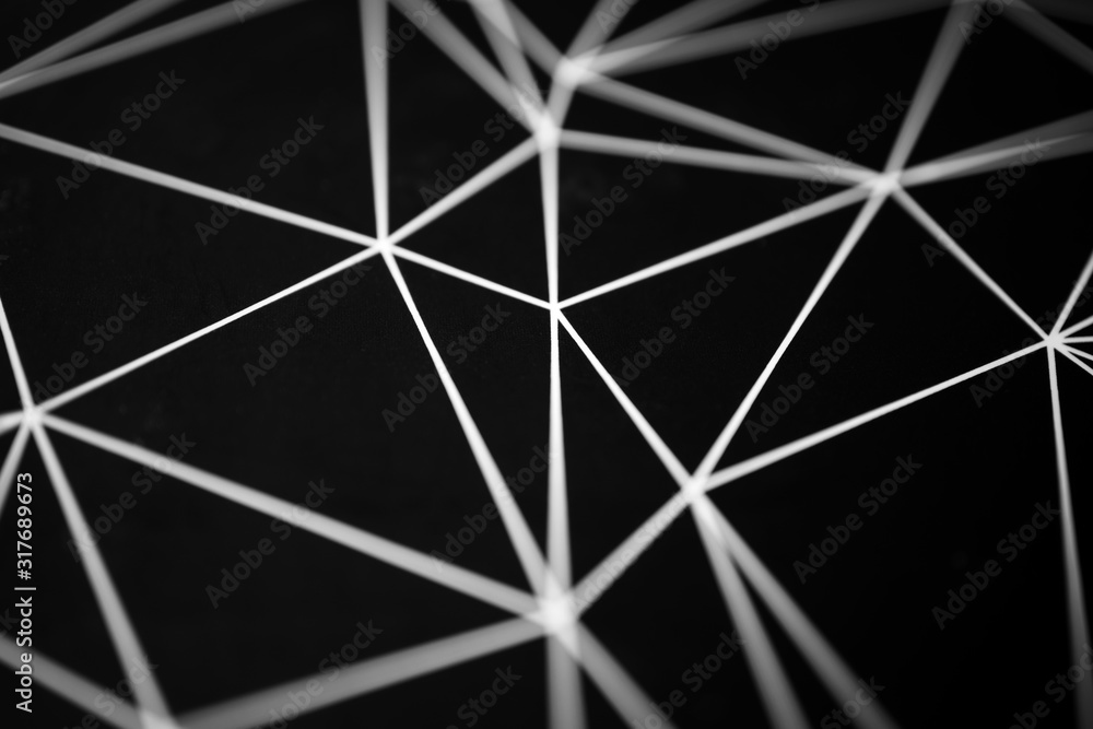 White lines on black background with selective focus background. Abstract geometric shape pattern White lines on black background with selective focus background. Abstract geometric shape pattern