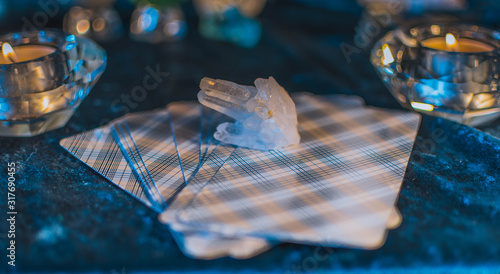 Clear quartz crystal on tarot cards