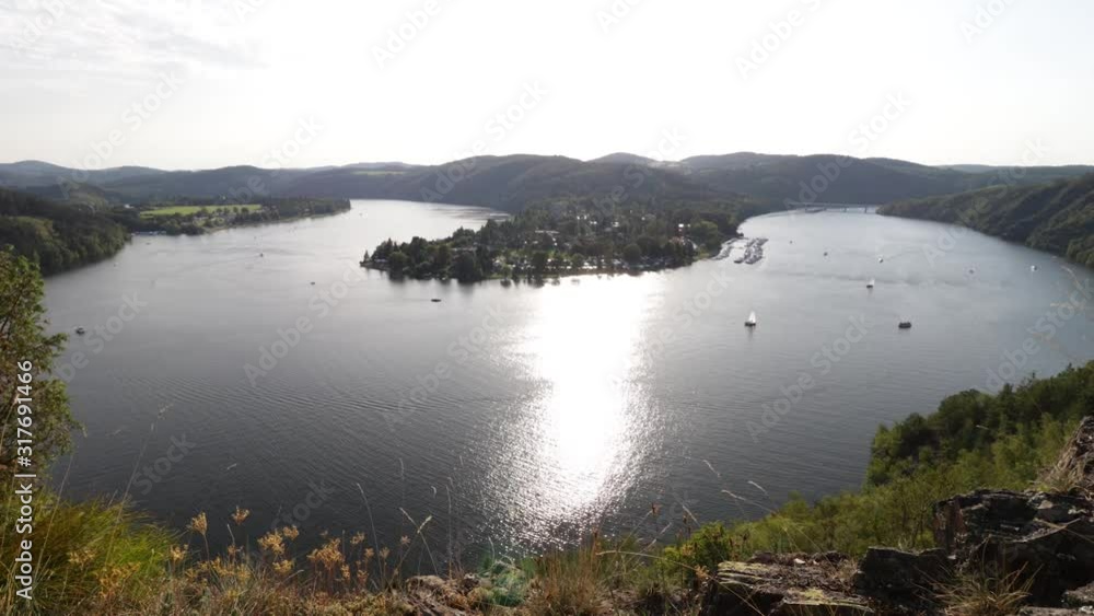 A time lapse of a river with boats and nature during daylight. A time lapse of a river with boats and nature during daylight.
