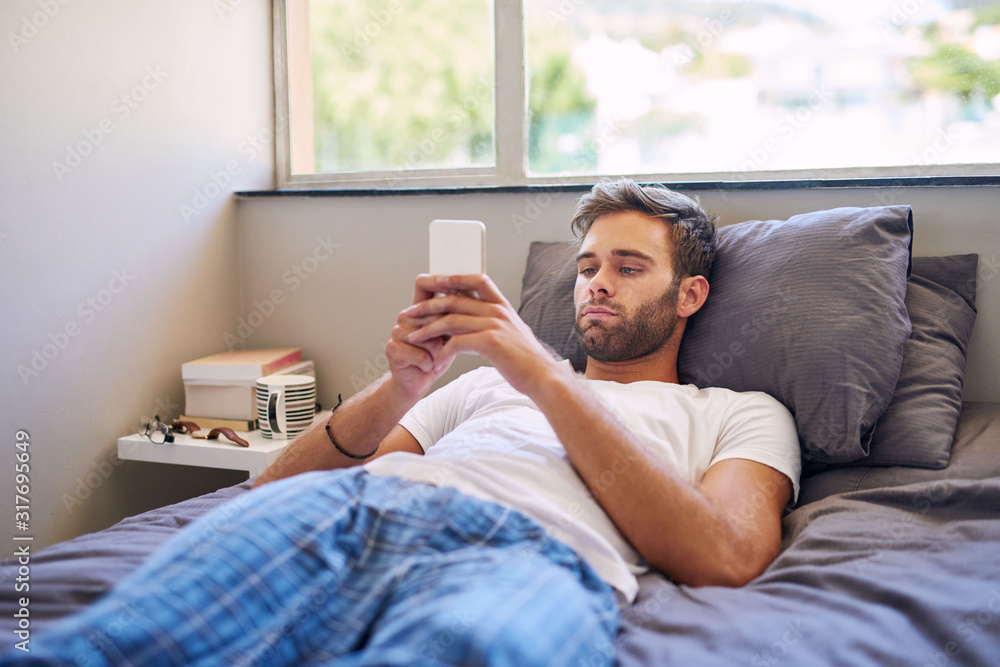 Catching up on his newsfeed from bed Catching up on his newsfeed from bed
