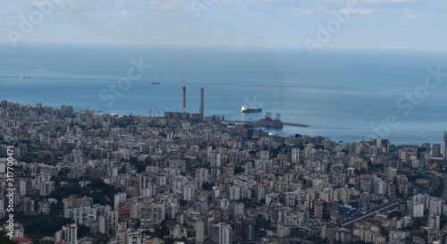 Aerial view of Kaslik city Lebanon, with the tower of the electricity plant that causes much discussion about politic corruption in Lebanon photo