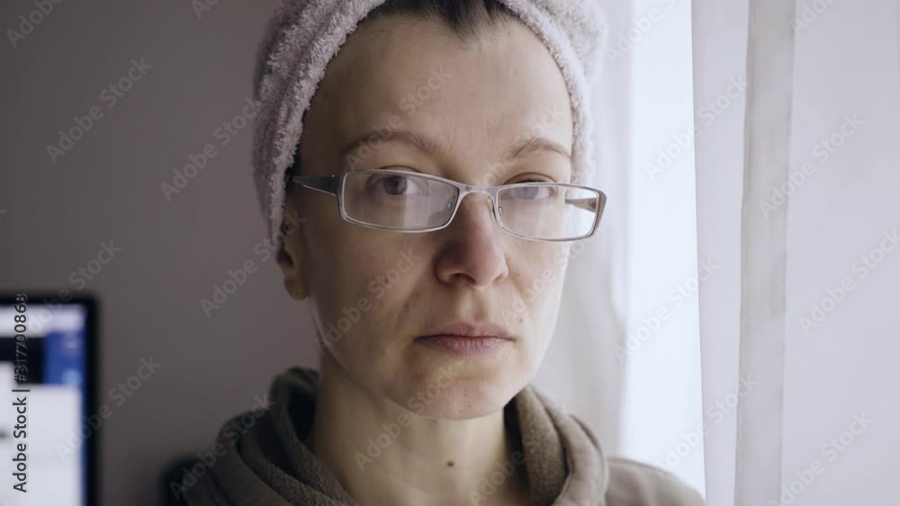 Portrait of a woman near the window after a shower. Portrait of a woman near the window after a shower.