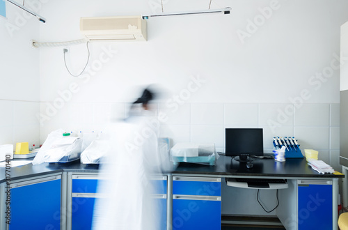 young researcher works in chemistry laboratory
