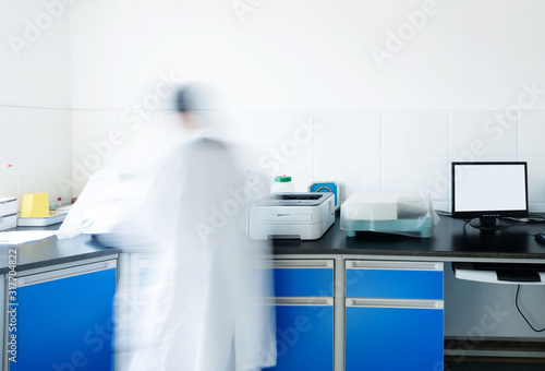 young researcher works in chemistry laboratory