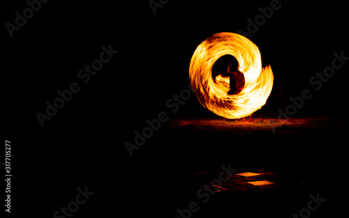 juggling with fire, show steel wool or swing fire and light on the beach dance man, Rotating lights