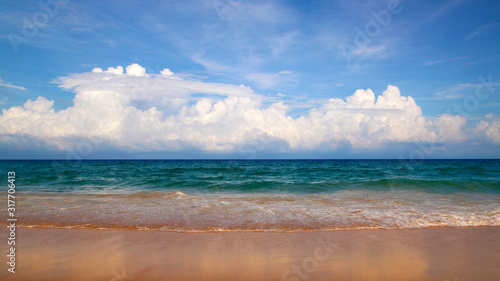 Karon beach  tranquil sea and wonderful cloudy sky  Phuket  Thailand