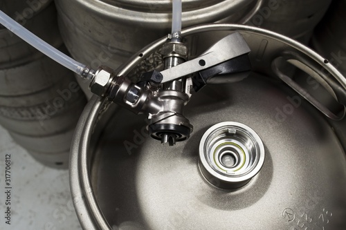 Photography Top view of a keg with a detached coupler and pipes