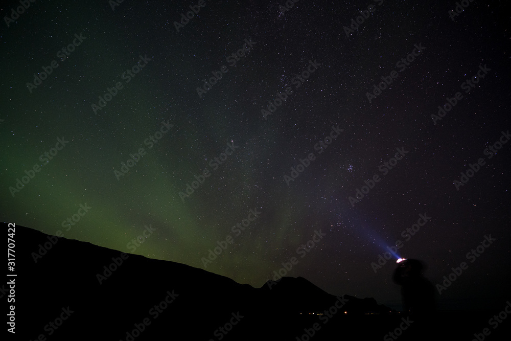 iceland aurora borealis north lights night sky with moon and stars