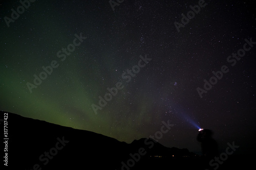 iceland aurora borealis north lights night sky with moon and stars