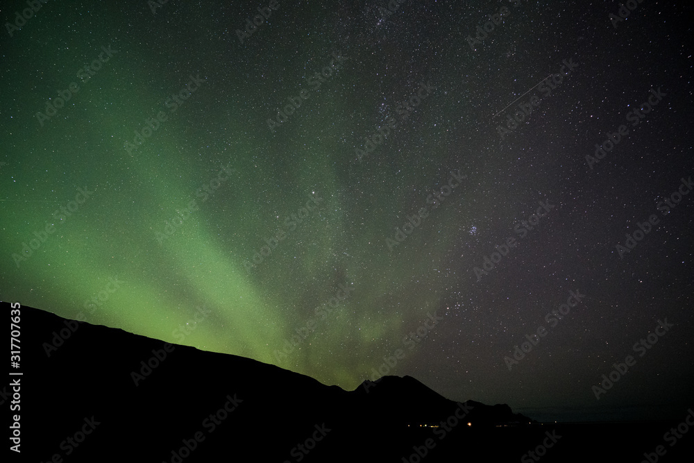 iceland aurora borealis northern lights night sky with moon and stars