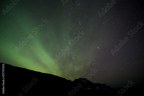 iceland aurora borealis northern lights night sky with moon and stars