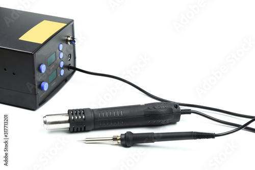 Soldering station with LED display, heating control regulator, with hot air gun and soldering iron. Isolated on a white background. - Image