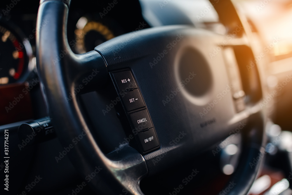 Control buttons on the steering wheel in modern car.