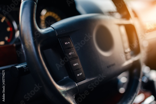 Control buttons on the steering wheel in modern car.