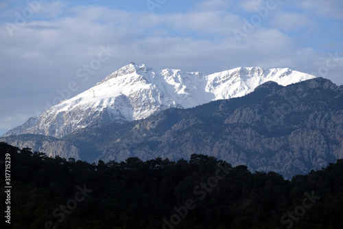 Landscape with view of Western Tavr with Tahtali peak covered with clean white clean snow. Tahtali is the highest Turkish mountain in Antalya region