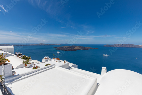 White architecture and amazing sea view from caldera. Fantastic summer vacation and travel destination scenic. Beautiful landscape, picturesque nature background